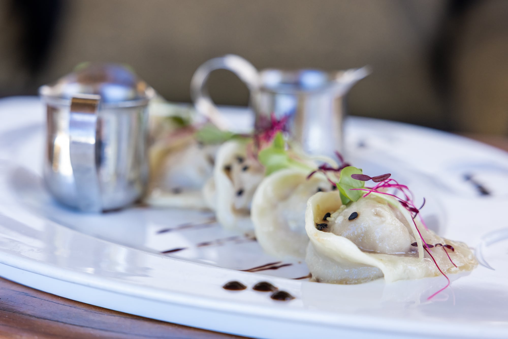 Dumplings with microgreens and dipping sauce at Duyên, the Vietnamese kitchen.
