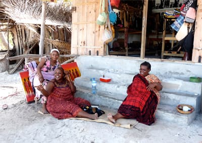 women in front of a souvenir shop