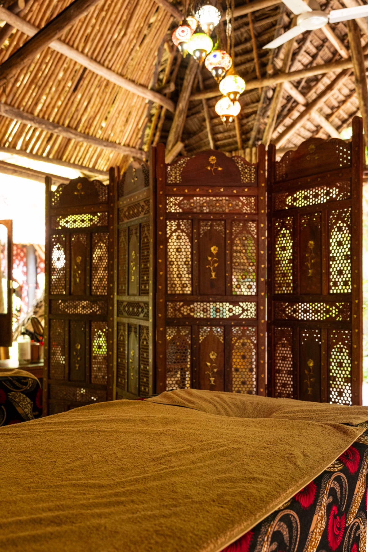 Hand-carved wooden bathtub ritual at Bustani Spa